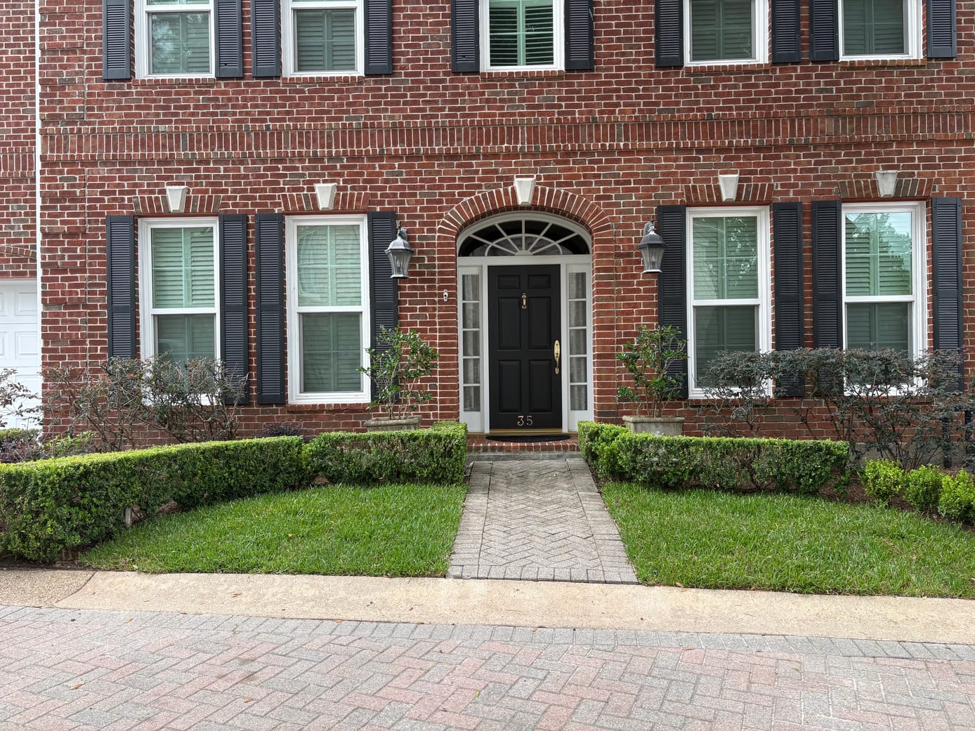 A wide view of the completed front entry, fully planted and composed after installation